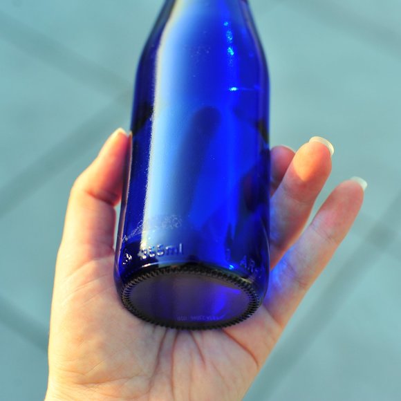 Exquisite Cobalt Blue Water Glass Bottle with Floral 3D Artwork - Picture 2 of 14